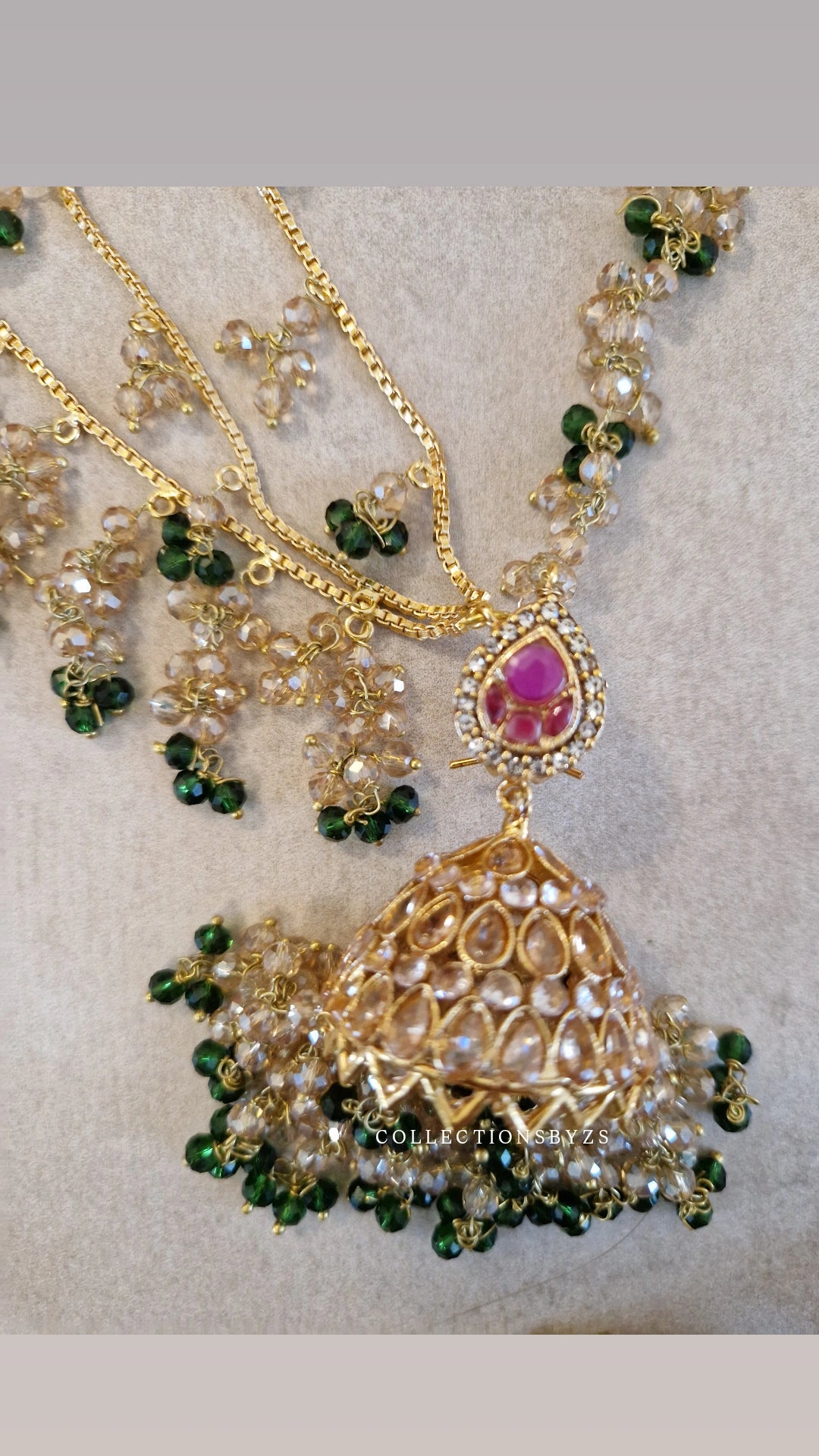 JAAN-  Luxury Pakistani Intricate Earrings with Sahara's, Tikka, Jhumar Set- DARK GREEN AND GOLD.