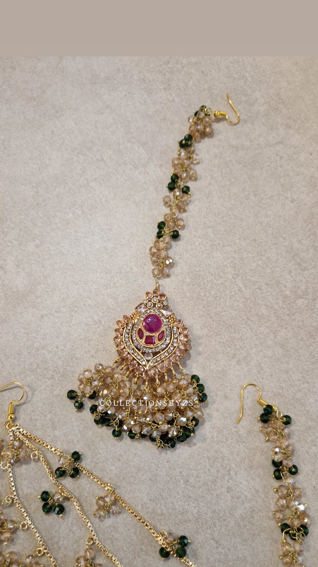 JAAN-  Luxury Pakistani Intricate Earrings with Sahara's, Tikka, Jhumar Set- DARK GREEN AND GOLD.