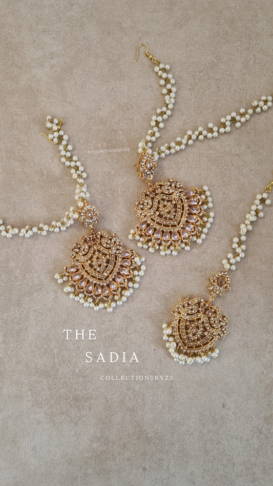 SADIA-  Elegant Stunning Earring & Tikka Set- Clear & GOLD pearls
